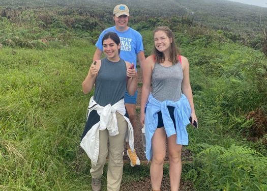 Abby Dell and two other study abroad students on a hill.