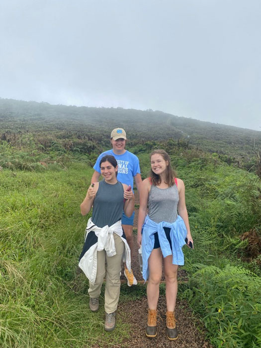 Abby Dell and two other study abroad students on a hill